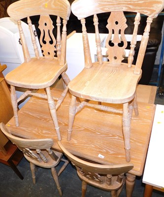 Lot 1007 - A limed kitchen table, the rectangular top on...