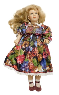 Lot 444 - A Fiba doll, wearing a floral dress and pearl...