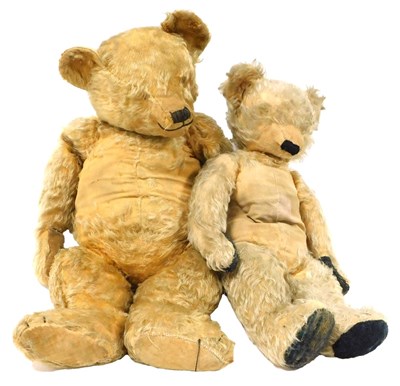 Lot 461 - A vintage gold plush teddy bear, straw filled,...