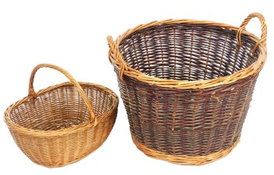 Lot 462 - A wicker twin-handled log basket, 56cm wide,...