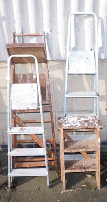 Lot 1019 - Two steel A frame step ladders, together with...