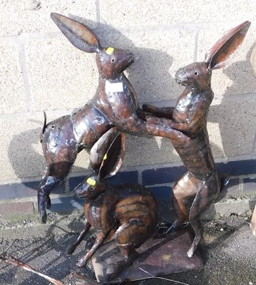 Lot 1025 - Metal garden sculptures, comprising two hares...