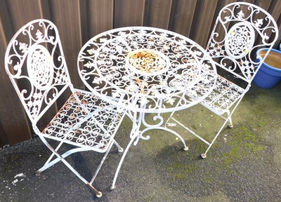 Lot 1062 - A cast metal garden suite, comprising a...