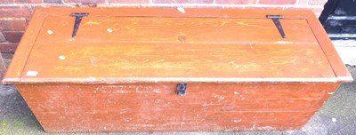 Lot 1067 - A stained pine chest, the hinged lid enclosing...