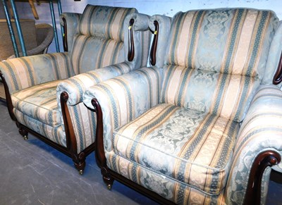 Lot 1154 - A pair of wingback armchairs, with striped...