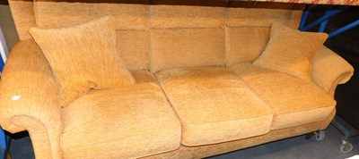 Lot 1102 - A Parker Knoll three seater sofa, in sand...