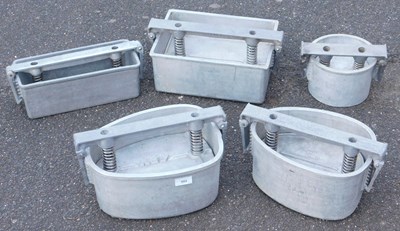 Lot 502 - Five aluminium meat or terrine presses.