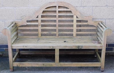 Lot 505 - A Lutyens style three seater garden bench,...