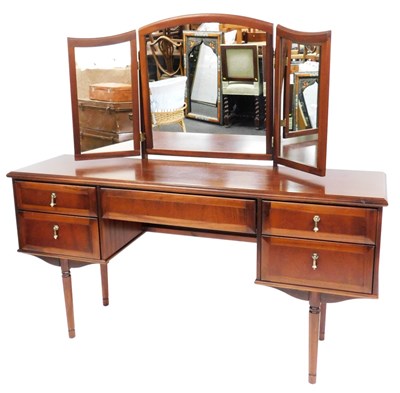 Lot 513 - A Meredew teak dressing table, with a triptych...