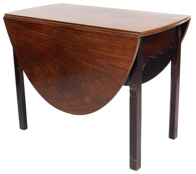 Lot 528 - A Georgian mahogany drop leaf dining table,...
