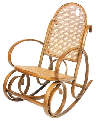 Lot 539 - A bentwood rocking chair, with a cane seat and...