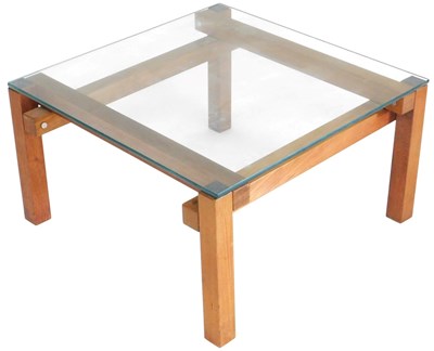 Lot 548 - A light oak coffee table, with a square glass...