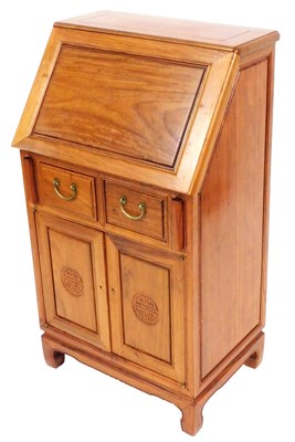 Lot 557 - A Chinese hardwood bureau, the full flap...