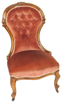 Lot 558 - A Victorian walnut spoon back nursing chair,...