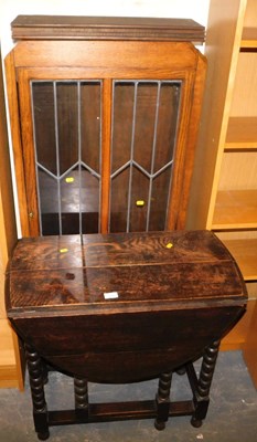 Lot 1109 - An oak gate leg table, together with an oak...