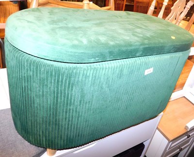 Lot 1115 - A green velvet style upholstered ottoman, the...
