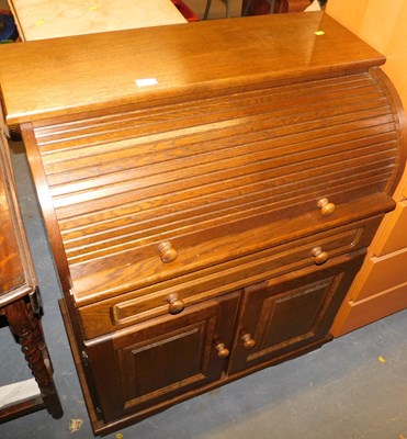 Lot 1147 - An oak roll top desk, enclosing an arrangement...