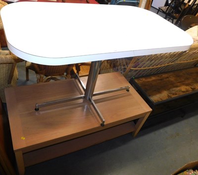 Lot 1149 - An oak veneer two tier coffee table, 44cm high...