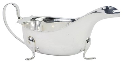 Lot 56 - A George VI silver sauceboat, with a gadrooned...