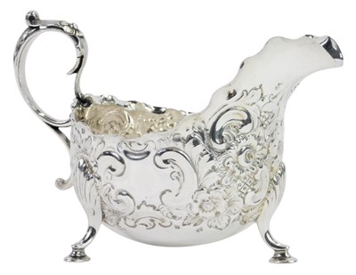 Lot 57 - A Victorian silver cream jug, with a waved...