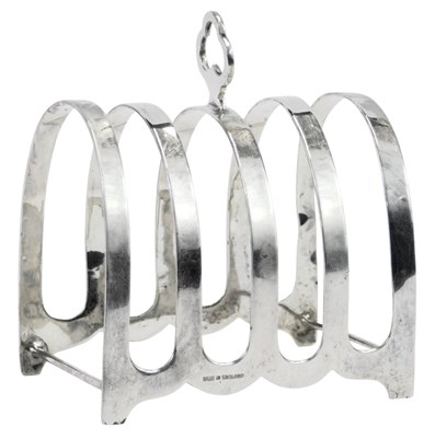 Lot 59 - A George VI silver four division toast...