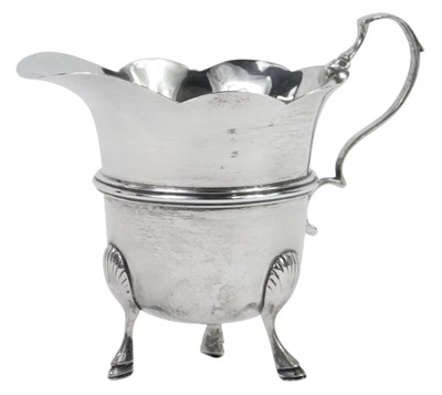 Lot 63 - A Victorian silver cream jug, with a waved rim,...
