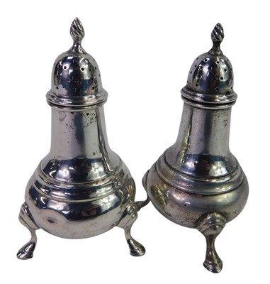 Lot 208 - A pair of George V silver pepper pots, each of...