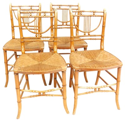 Lot 575 - A set of four Regency bamboo dining chairs,...