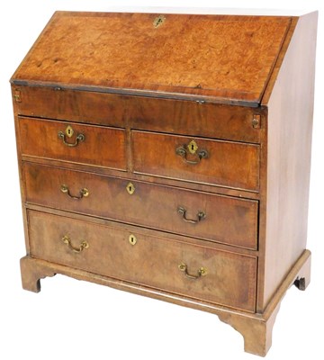 Lot 578 - A George III mahogany and burr walnut bureau,...