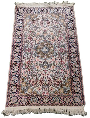 Lot 588 - A Kashmiri silk rug, the central field with a...