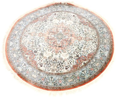 Lot 589 - A Tabriz circular cream silk rug, with a...
