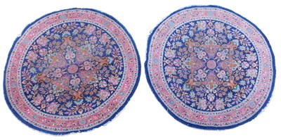 Lot 591 - A pair of Persian circular wool blue ground...