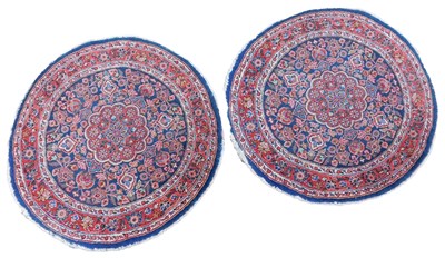 Lot 592 - A pair of Persian circular blue ground wool...