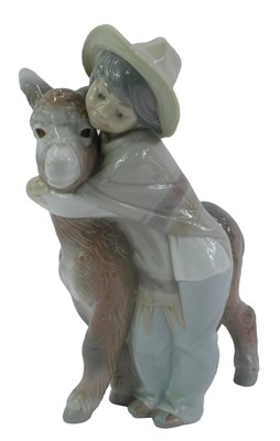 Lot 31 - A Lladro porcelain figure group, modelled as a...