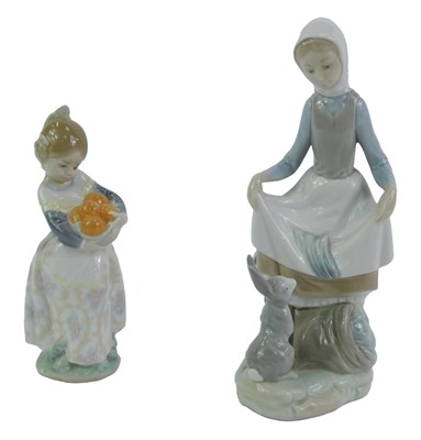Lot 33 - Two Lladro porcelain figures, modelled as a...