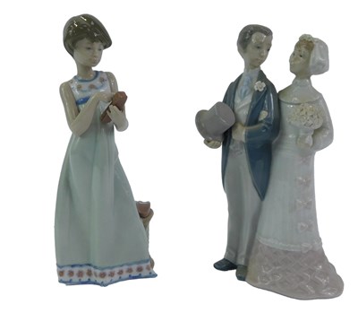 Lot 37 - A Lladro porcelain figure group, modelled as a...