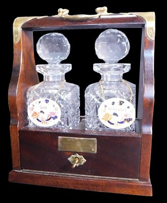 Lot 46 - A 20thC mahogany and brass bound Tantalus,...