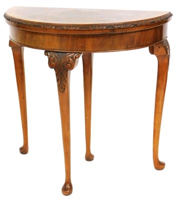 Lot 594 - A Georgian style mahogany and walnut demi-lune...