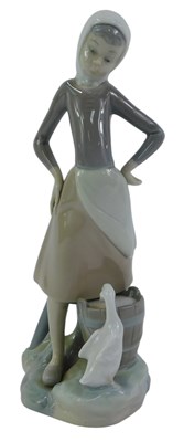 Lot 276 - A Lladro porcelain figure group, modelled as a...