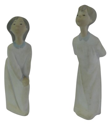 Lot 279 - Two Nao porcelain figures, modelled as a girl...
