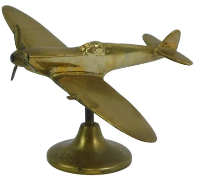Lot 122 - A brass model of a Spitfire, on a circular...