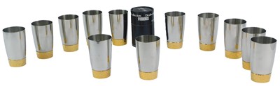 Lot 127 - A set of twelve Viners stainless steel beakers,...
