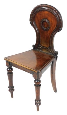 Lot 580 - A Victorian mahogany balloon back hall...