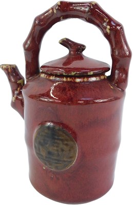 Lot 143 - A 20thC Oriental style pottery red glaze...