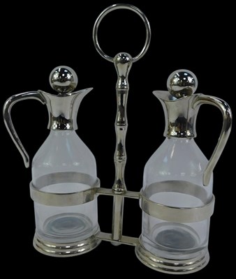 Lot 145 - A twin division metal cruet, for oil and...