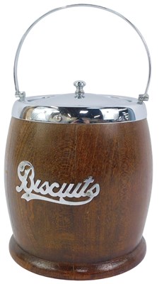 Lot 146 - An oak biscuit barrel, with metal mount and...