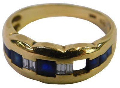 Lot 68 - A sapphire and diamond band, set with nine...