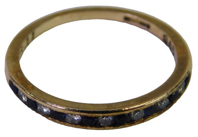 Lot 73 - A 9ct gold sapphire and diamond half hoop ring,...