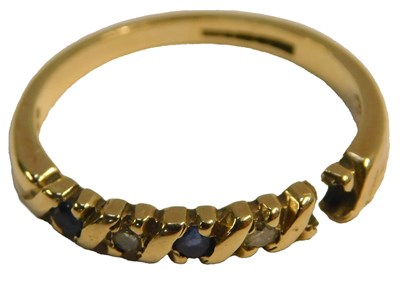 Lot 69 - A 9ct gold sapphire and diamond dress ring,...