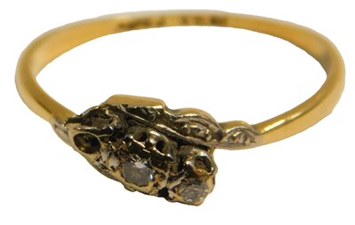 Lot 71 - A diamond three-stone ring, in a crossover...
